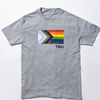 A short-sleeved heathered grey t-shirt features the Pride Progress flag with a small TMU in black.