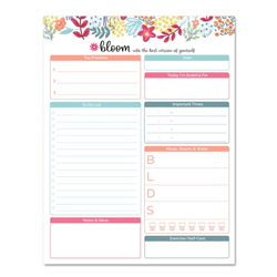 A Bloom brand eight and a half inch by eleven inch planning pad with botanical details.