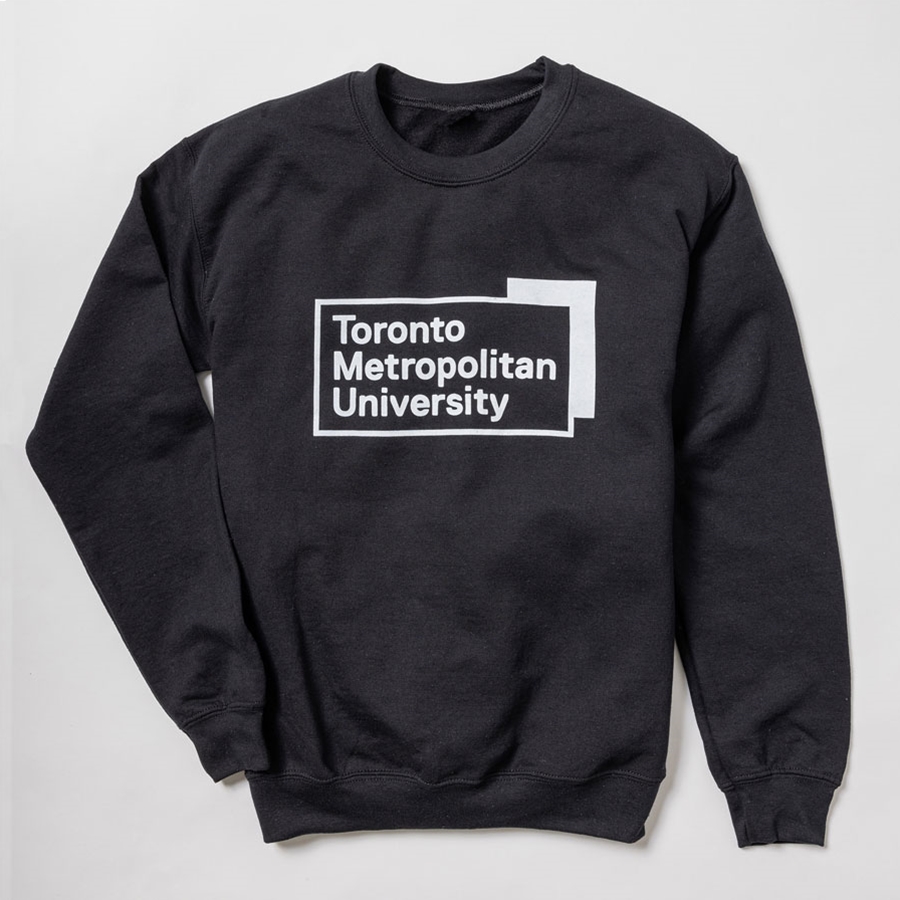A black pullover fleece crew neck sweatshirt features the "Toronto Metropolitan University" university logo, printed front & centre in white.