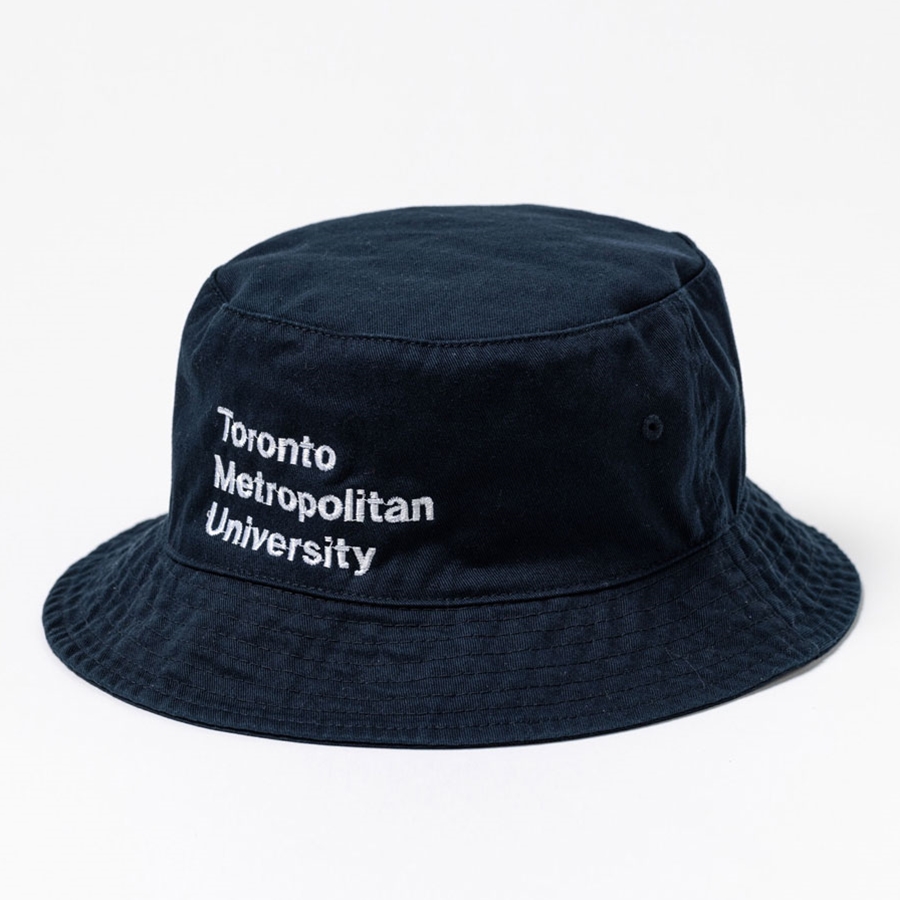A unstructured navy bucket hat that features the Stacked Wordmark Logo, in white