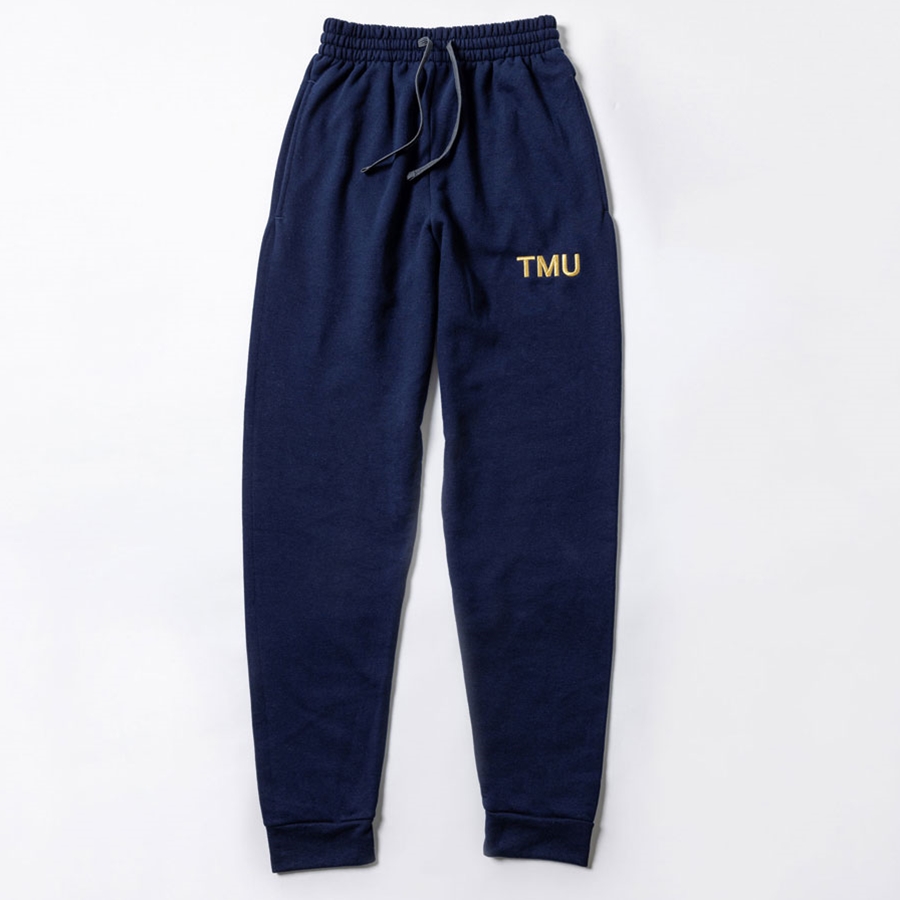 A navy fleece sweatpants features "TMU" on the left hip, embroidered with gold metallic thread.